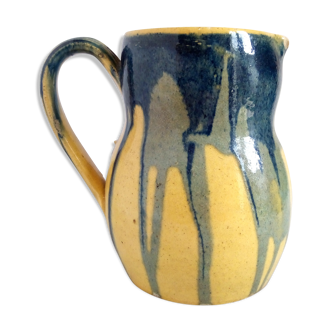 Yellow, blue and green rustic pitcher
