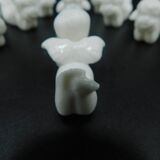 8 porcelain knife rests - Cherubs