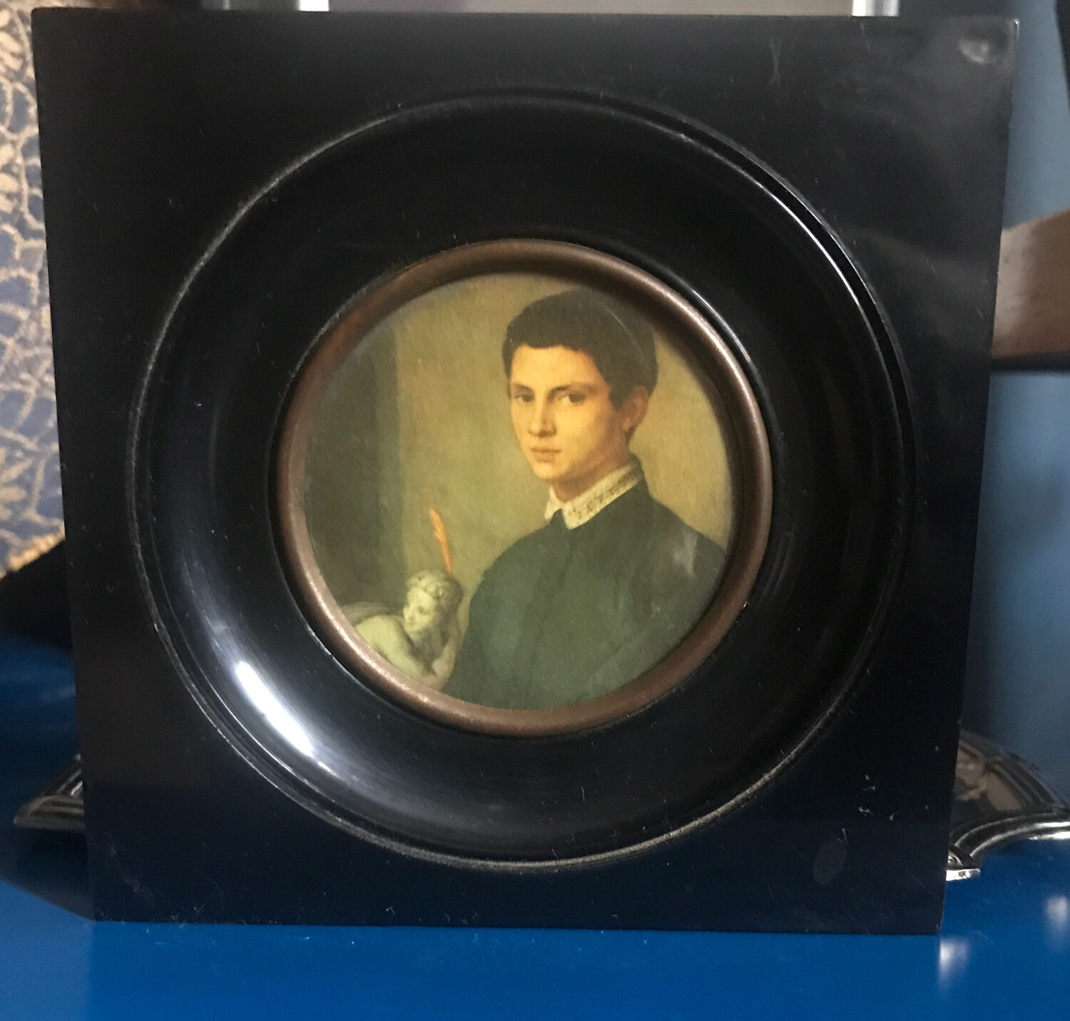 Two vintage round frame portraits