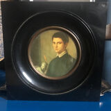 Two vintage round frame portraits