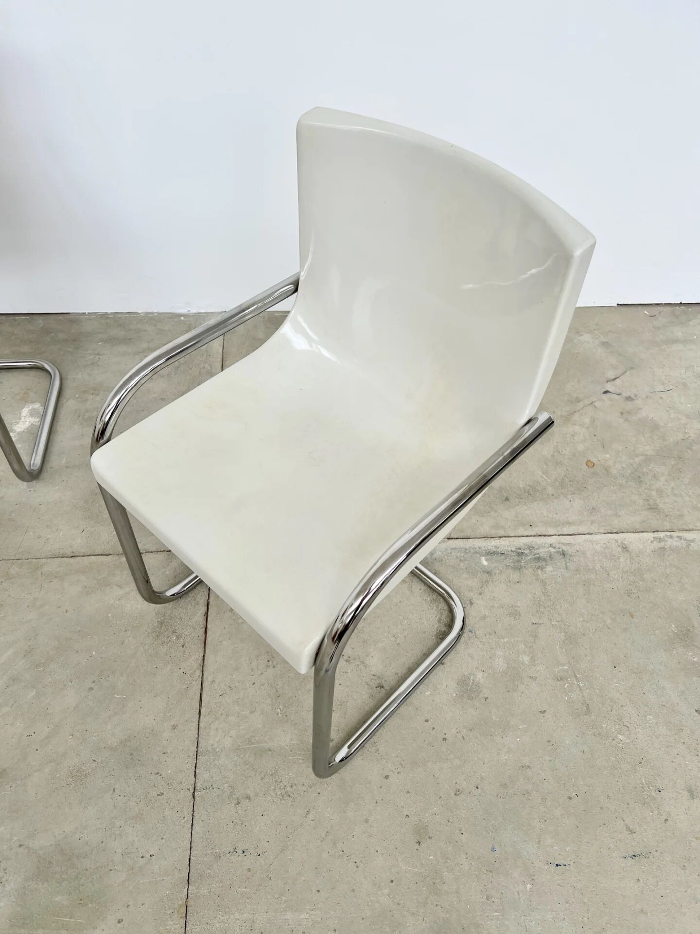Pair of white moulded shell chairs with chrome tube — Space Age 70s