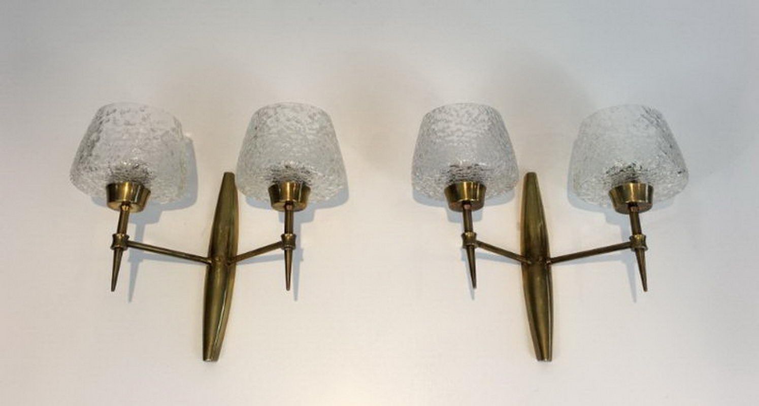 Pair of bronze sconces with worked glass reflectors