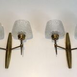 Pair of bronze sconces with worked glass reflectors