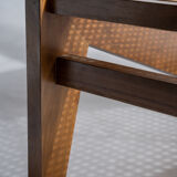 Reclined armchair in canned teak in natural wood
