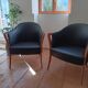 Pair of leather and wood armchairs in the style of Umberto Asnago.
