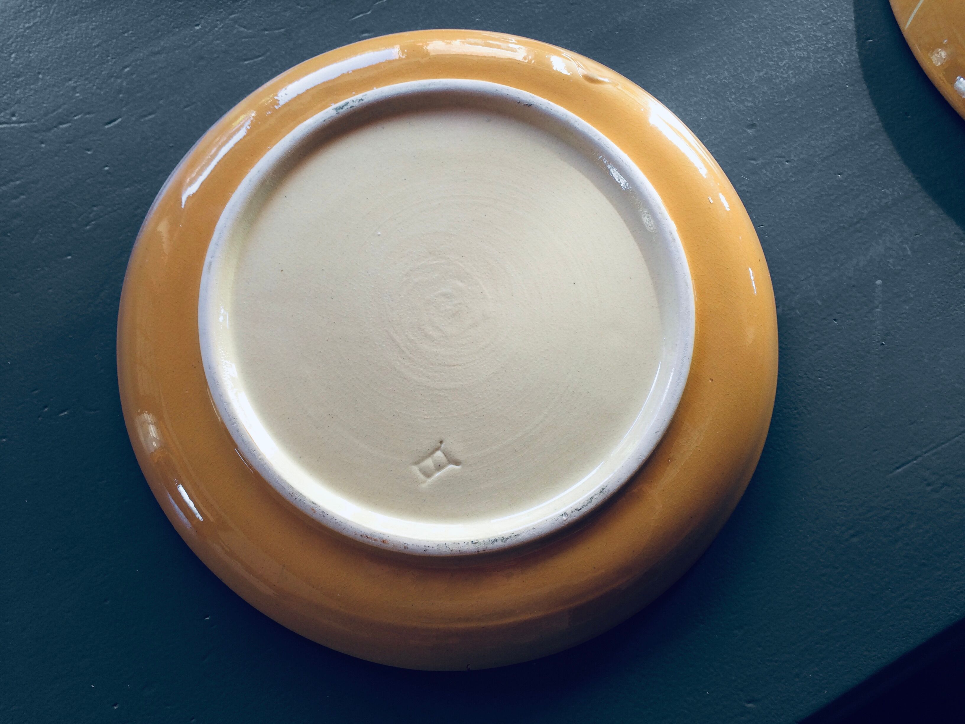 The six Piaf plates in painted terracotta