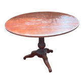 Old and large round winegrower's table made of wood.