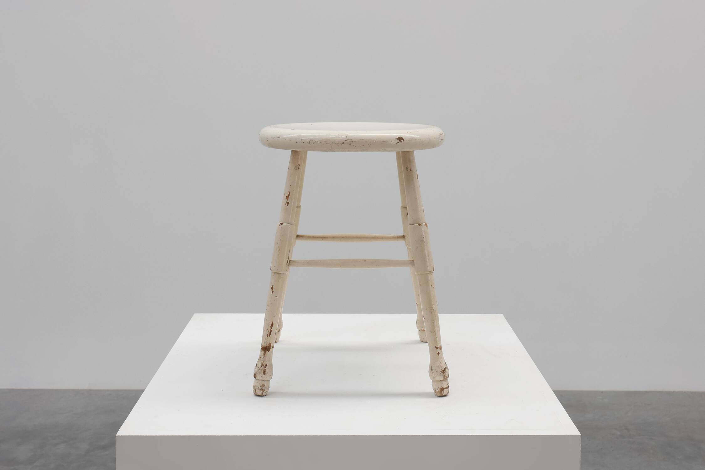 Rustic white wooden low farm stool, France ca. 1920