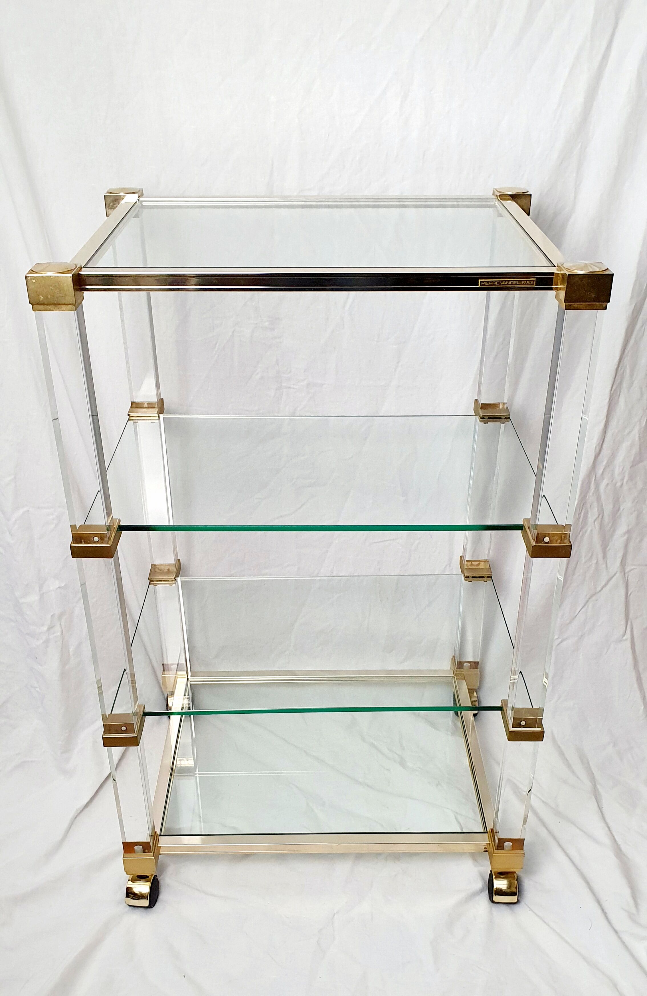 Rolling glass and plexiglass shelf by Pierre Vandel