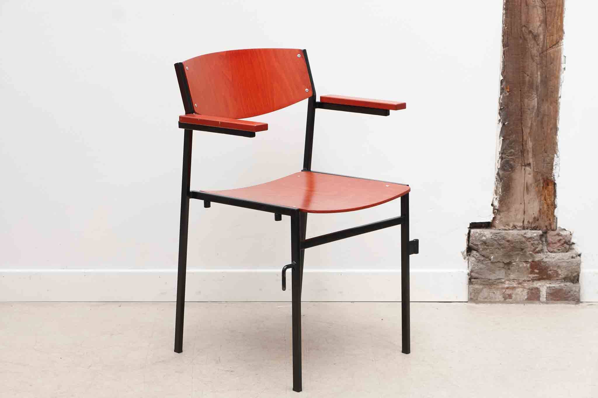 Gijs van der Sluis red and black chairs with armrests