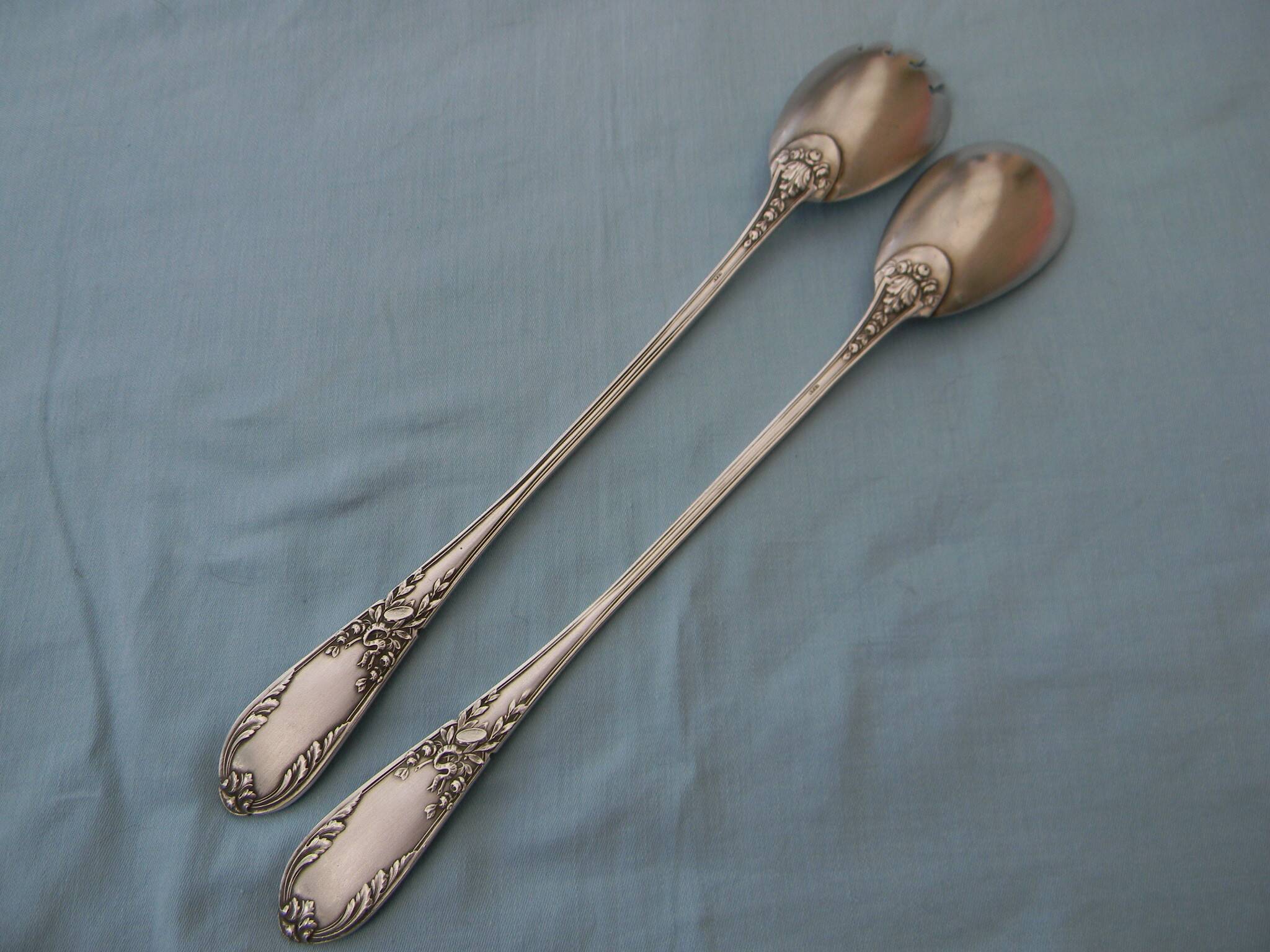 SFAM silver metal salad servers.