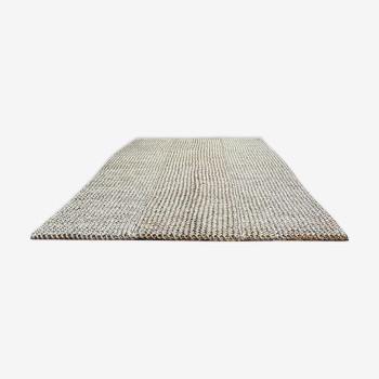 Handmade carpet in natural fiber of knitted palm leaf