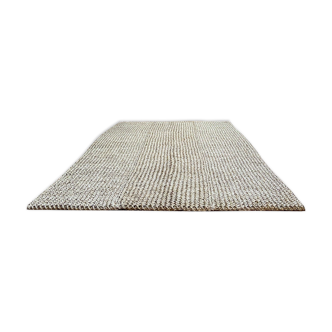 Handmade carpet in natural fiber of knitted palm leaf