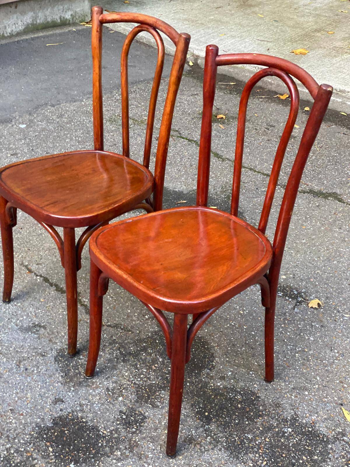 2 curved solid wood bistro chairs in Bordeaux.