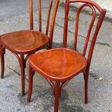 2 curved solid wood bistro chairs in Bordeaux.