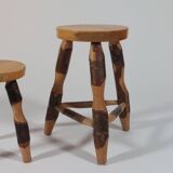 Pair of walnut stools sculpted in a vintage mid-century cross-section.