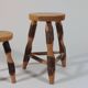 Pair of walnut stools sculpted in a vintage mid-century cross-section.