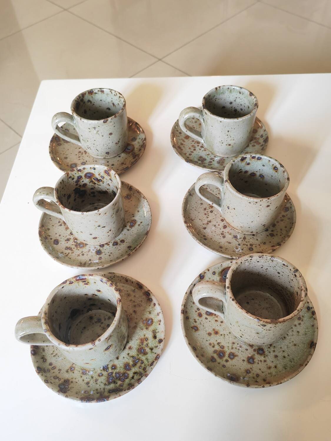 Series of stoneware cups and saucers