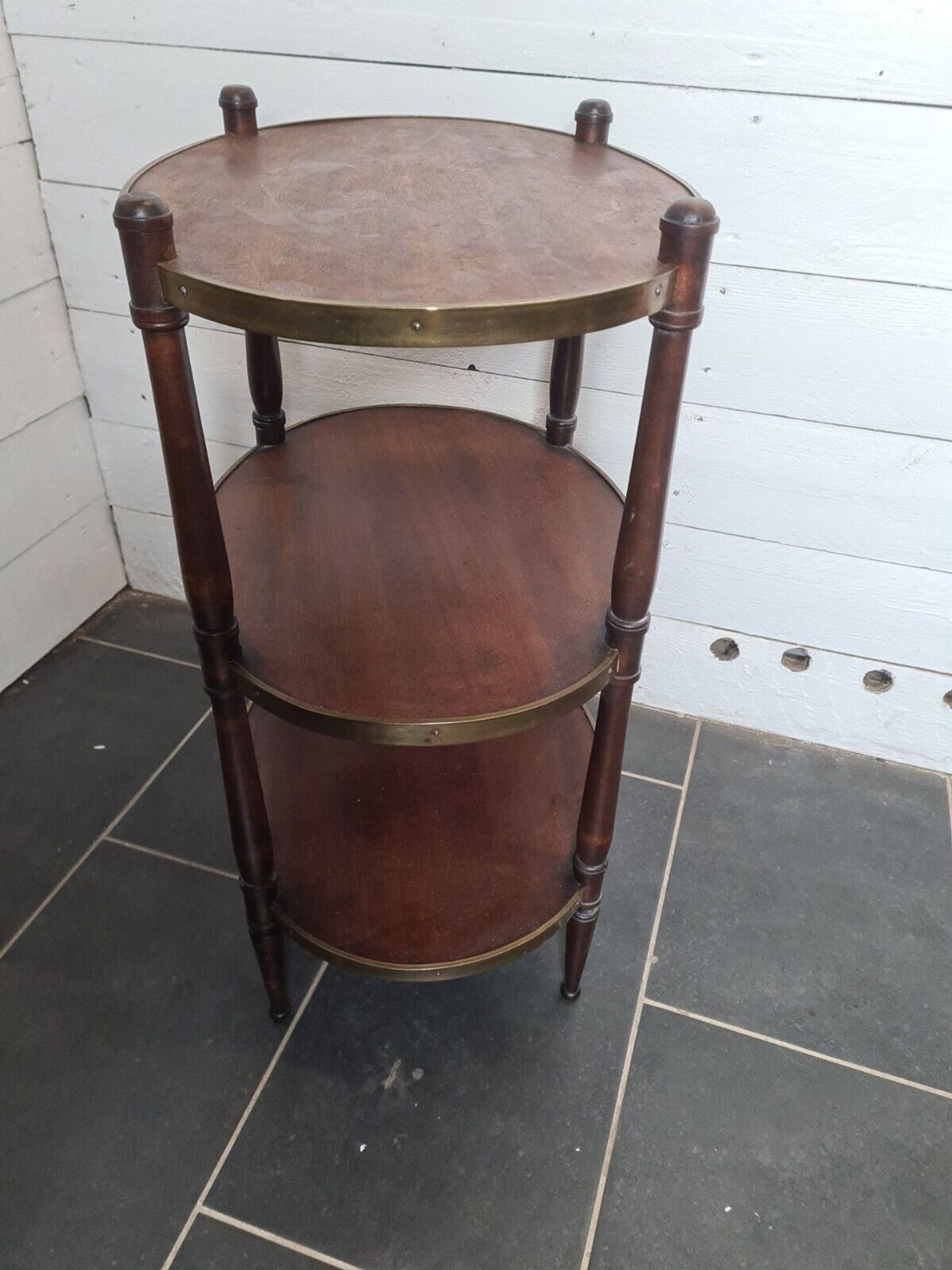 Oval mahogany side table has 3 floors