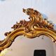 Miroir mural et console dorés de style baroque