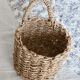 Small vintage woven fiber wall basket with handle