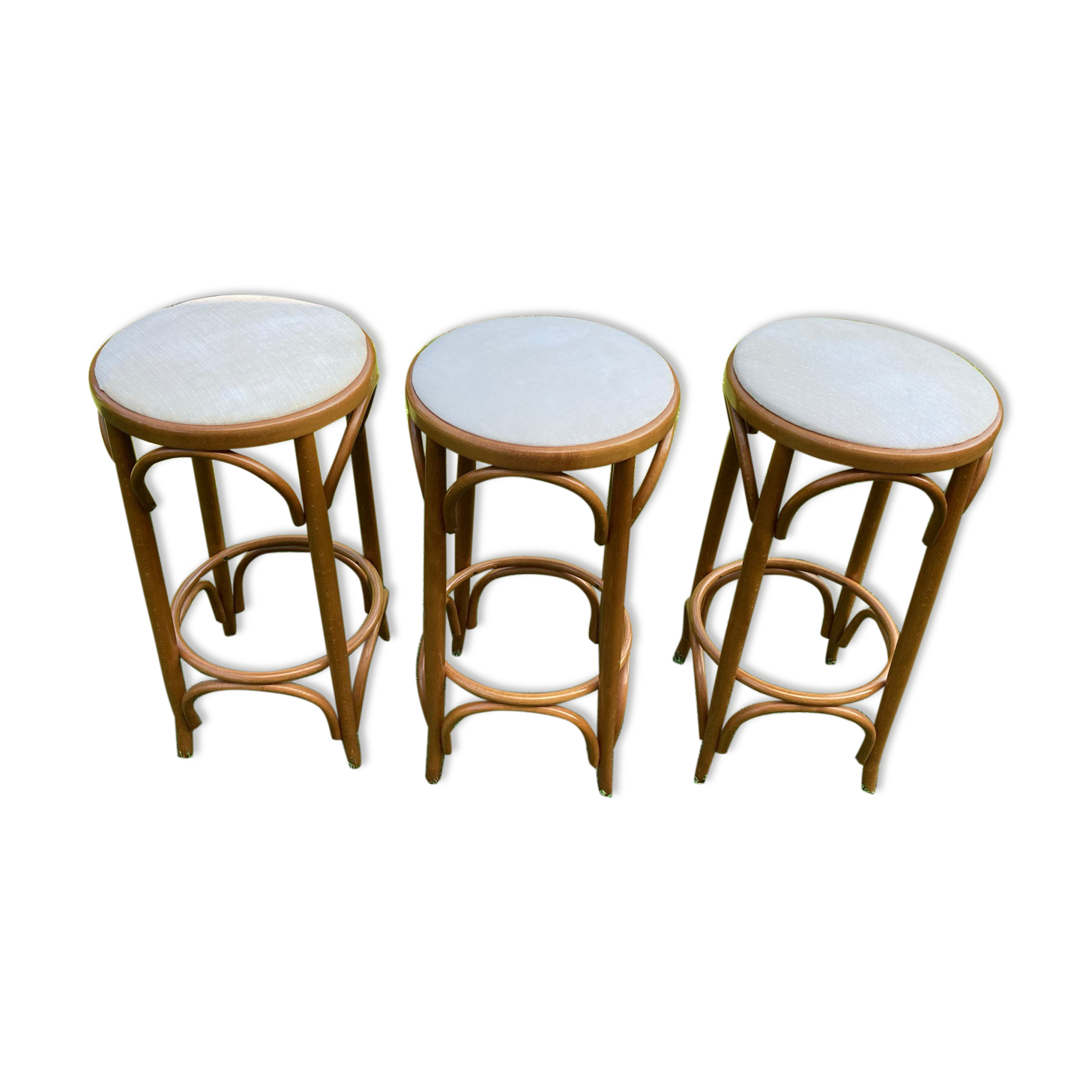 3 bar stools made of curved wood and fabric seat
