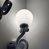 Cast iron and opaline wall lights from the 70s