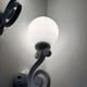 Cast iron and opaline wall lights from the 70s