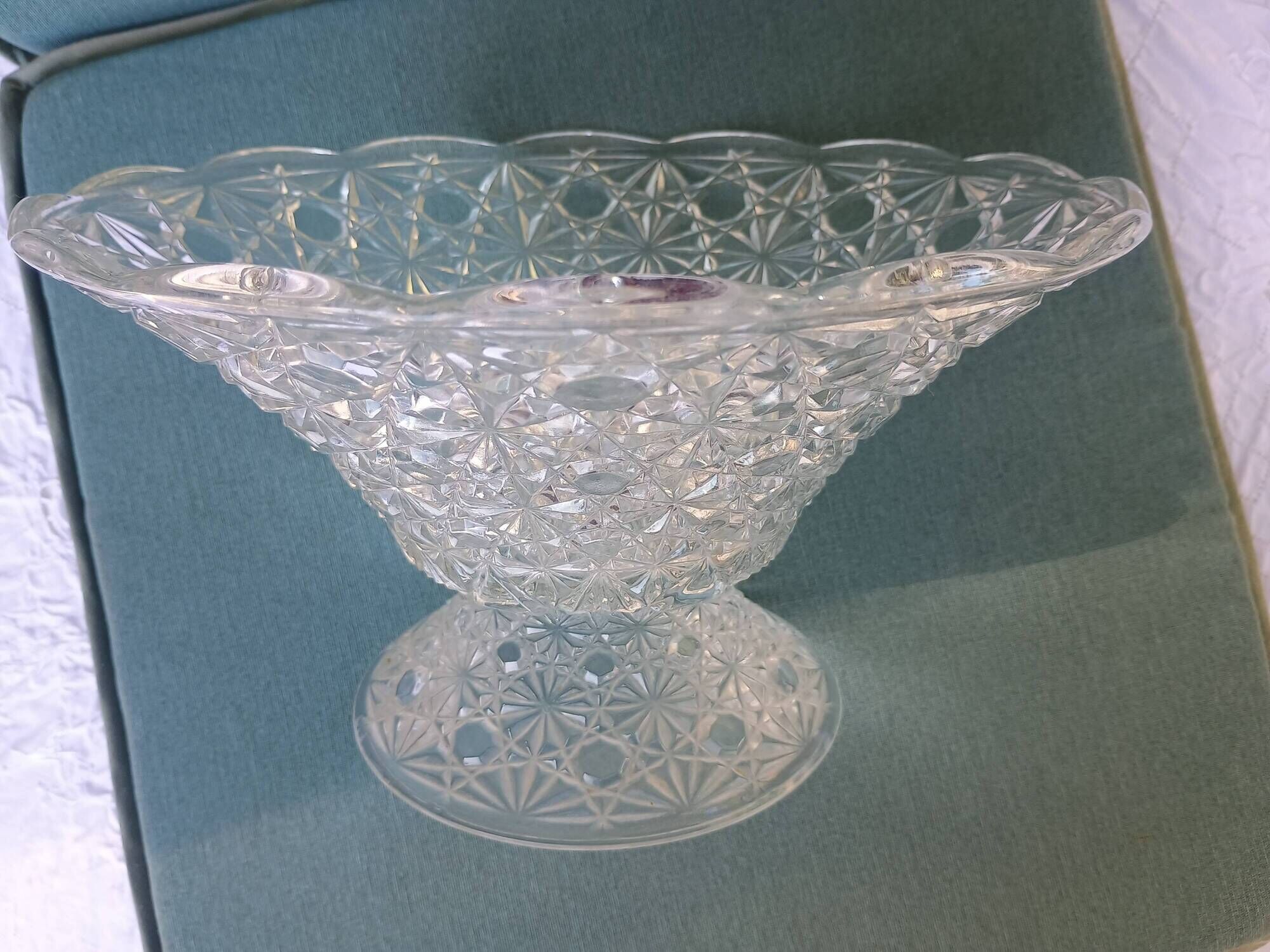 Flared fruit bowl with a pedestal, all made of pressed moulded glass, mid-20th century.