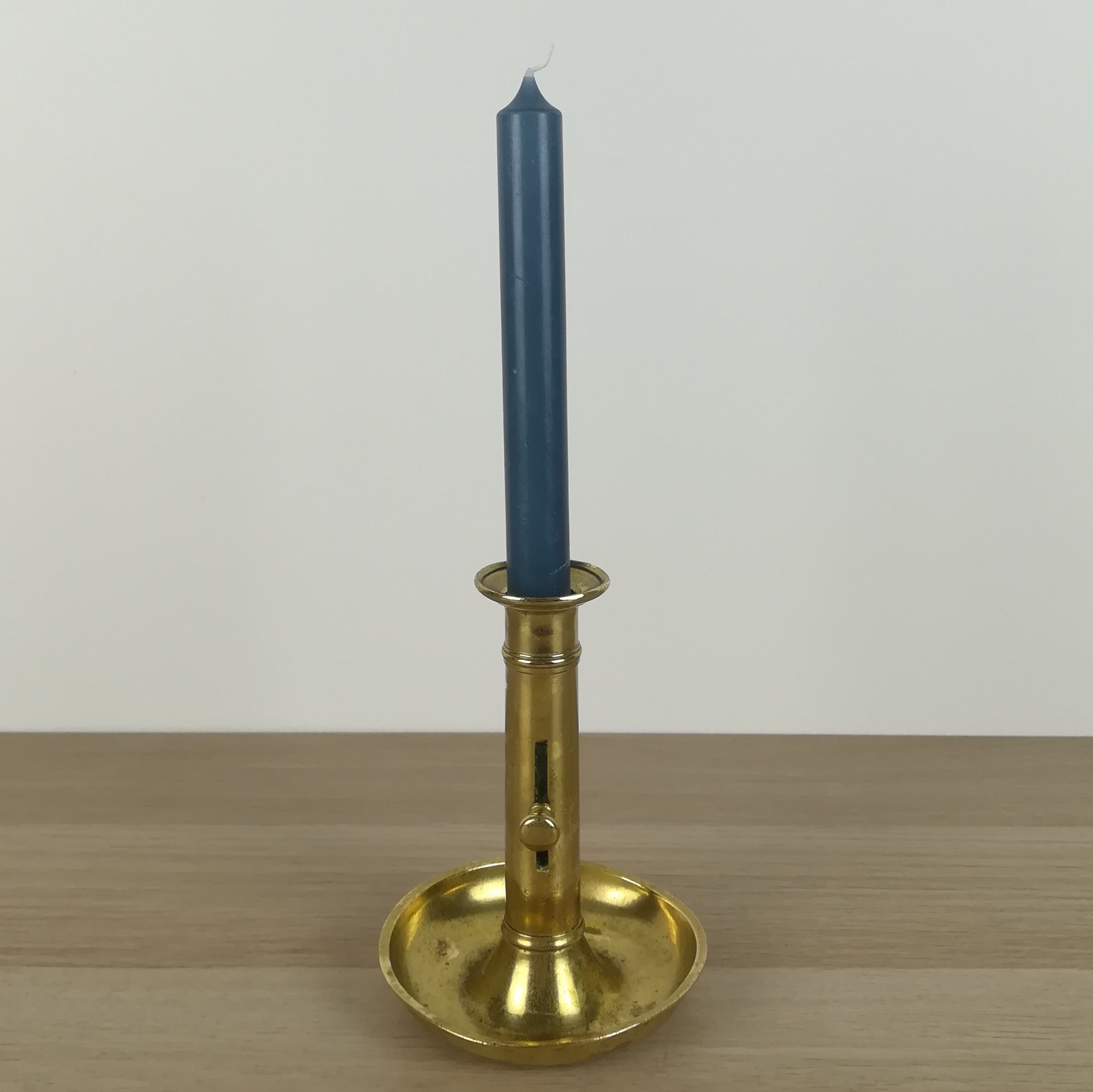 Brass pusher candle holder
