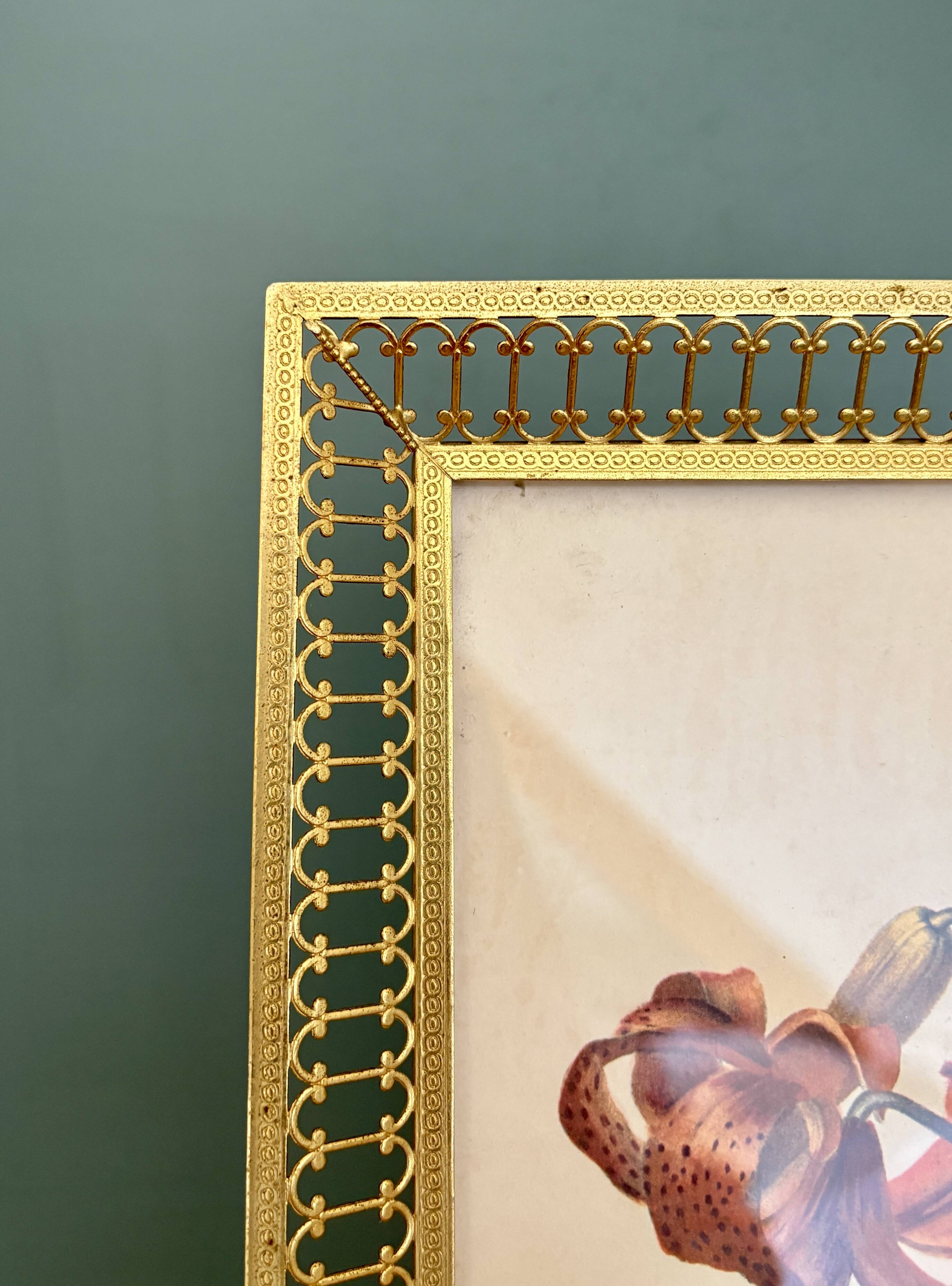 Antique gilt metal frame with flower engraving