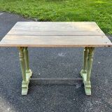 Old table with patinated green legs