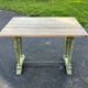 Old table with patinated green legs