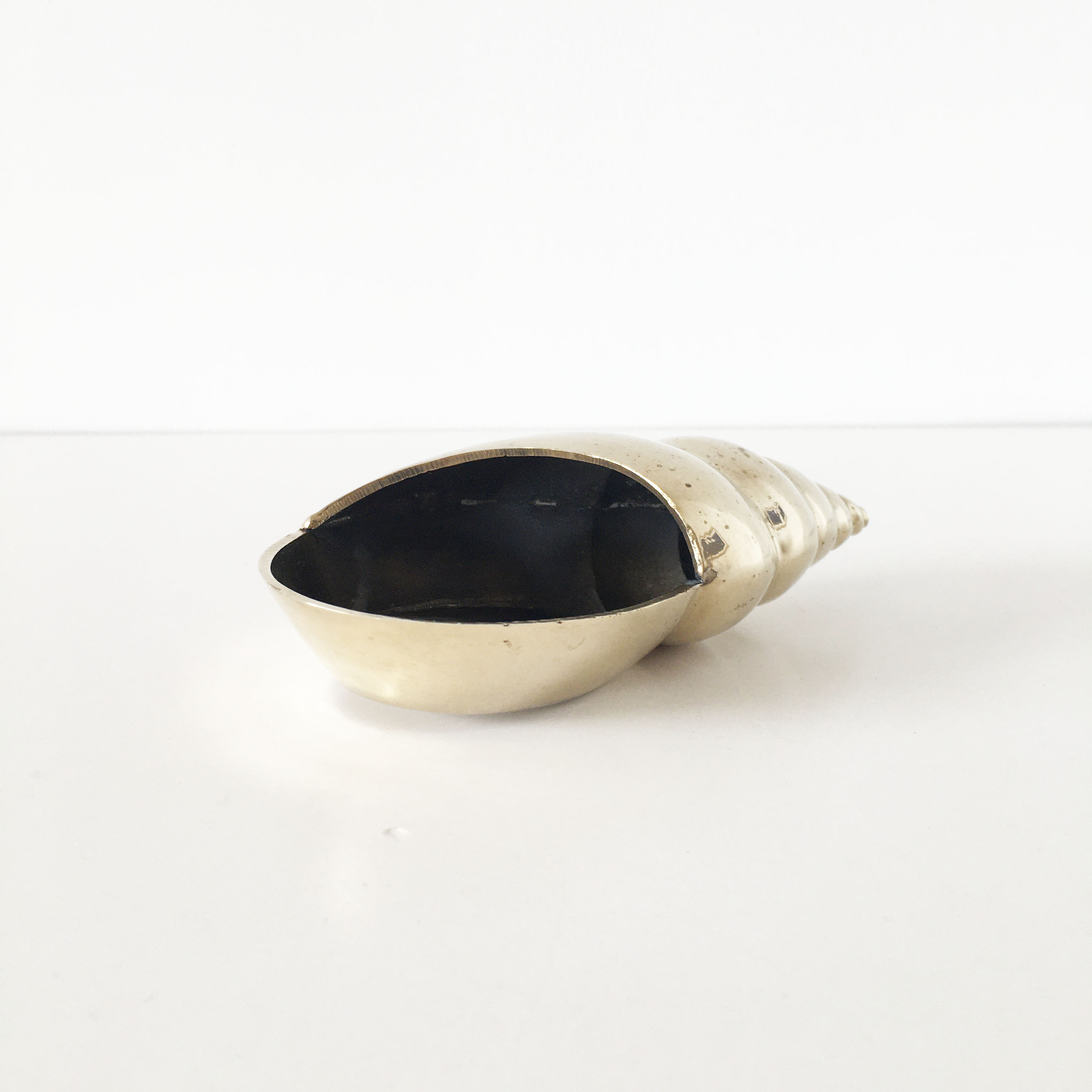 Vintage brass shell ashtray