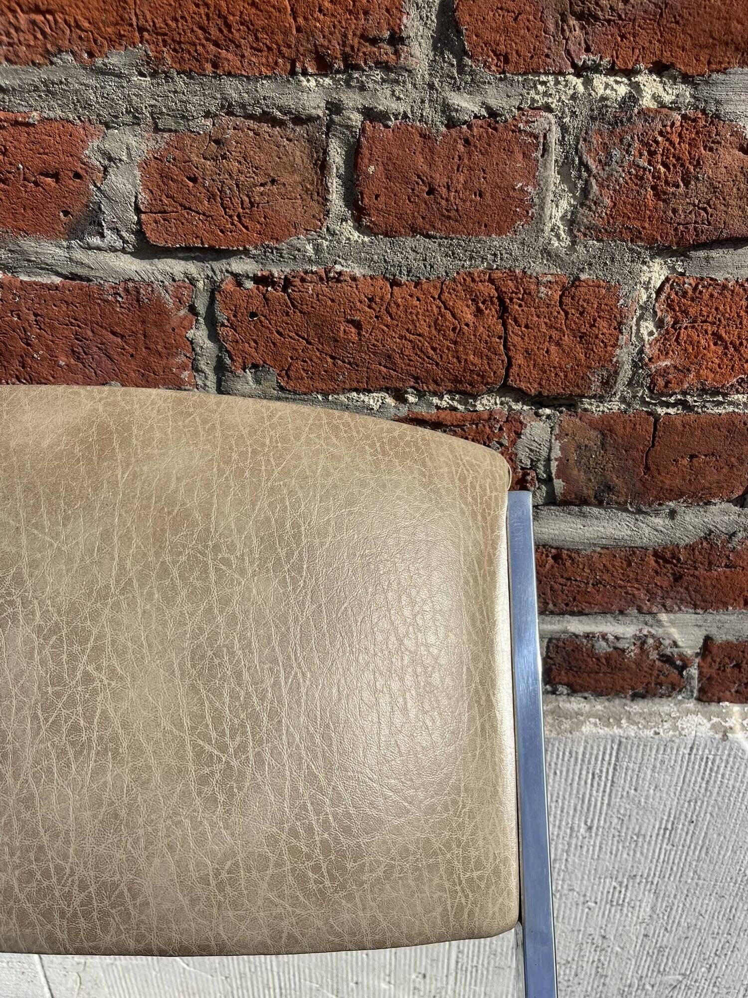 Set of 4 vintage chairs in chrome and faux leather.