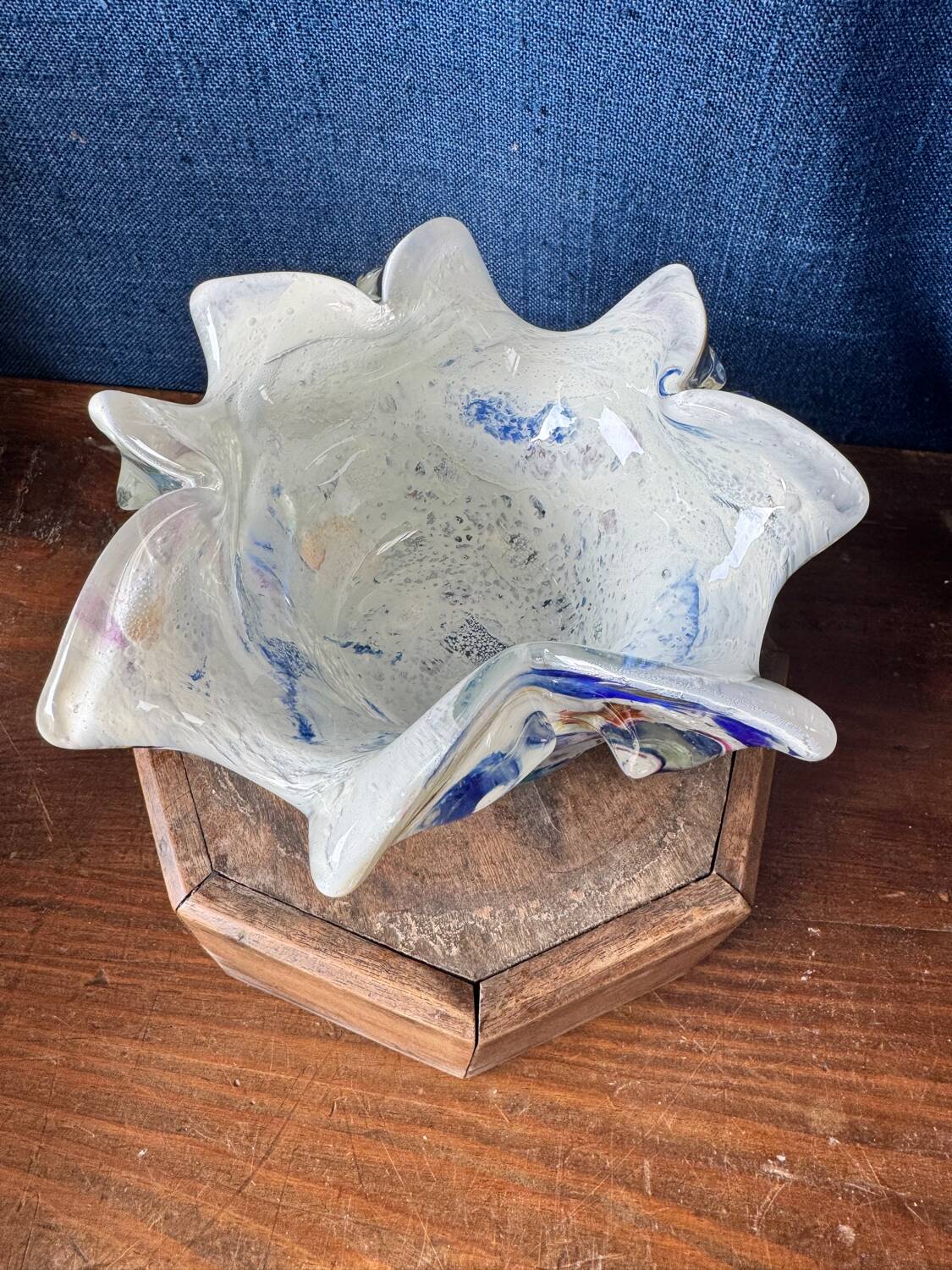Multi-layer glass ashtray with metallic oxide inclusions.