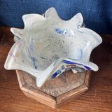 Multi-layer glass ashtray with metallic oxide inclusions.
