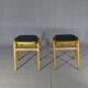 Two MID-Century green vinyl stools from the 1970s with tapered legs.