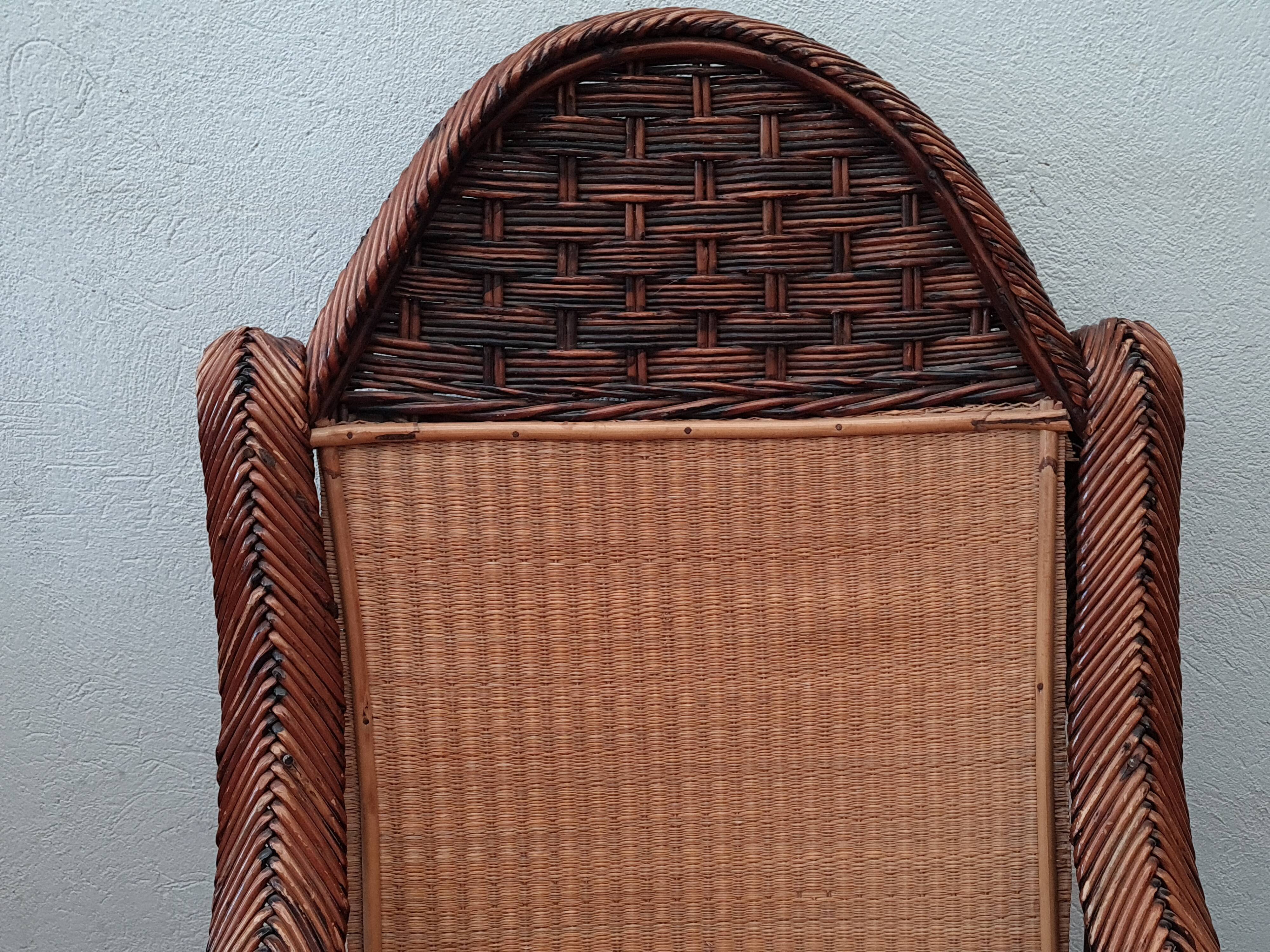 Old rattan armchair circa 1900-1930