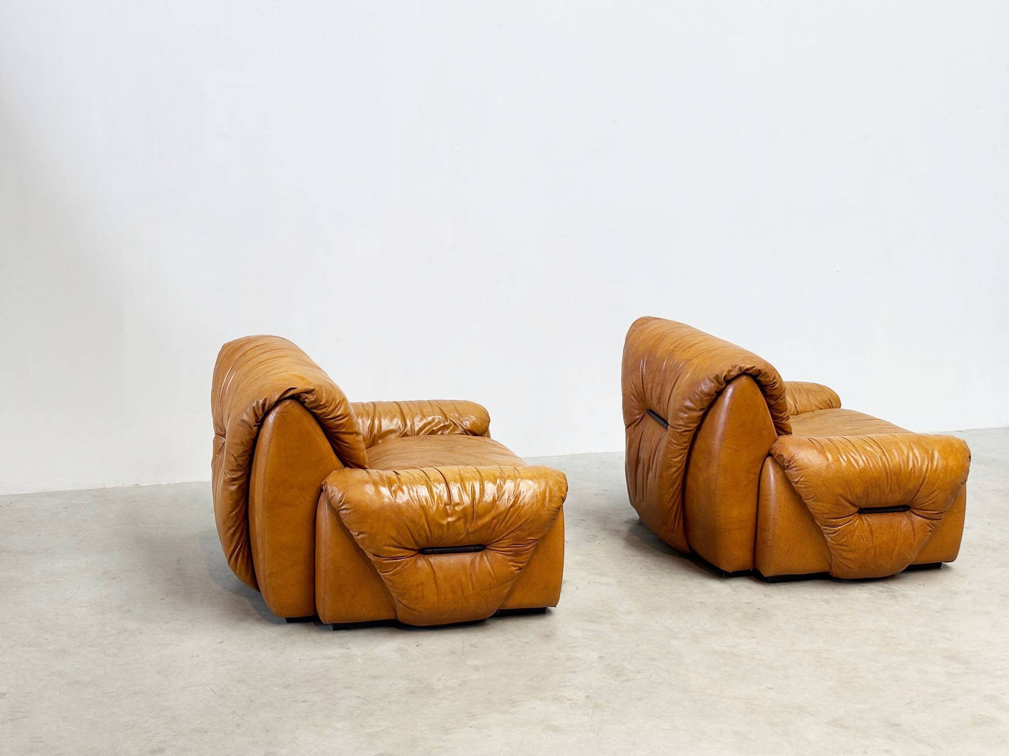 Set of two Italian cognac leather lounge chairs