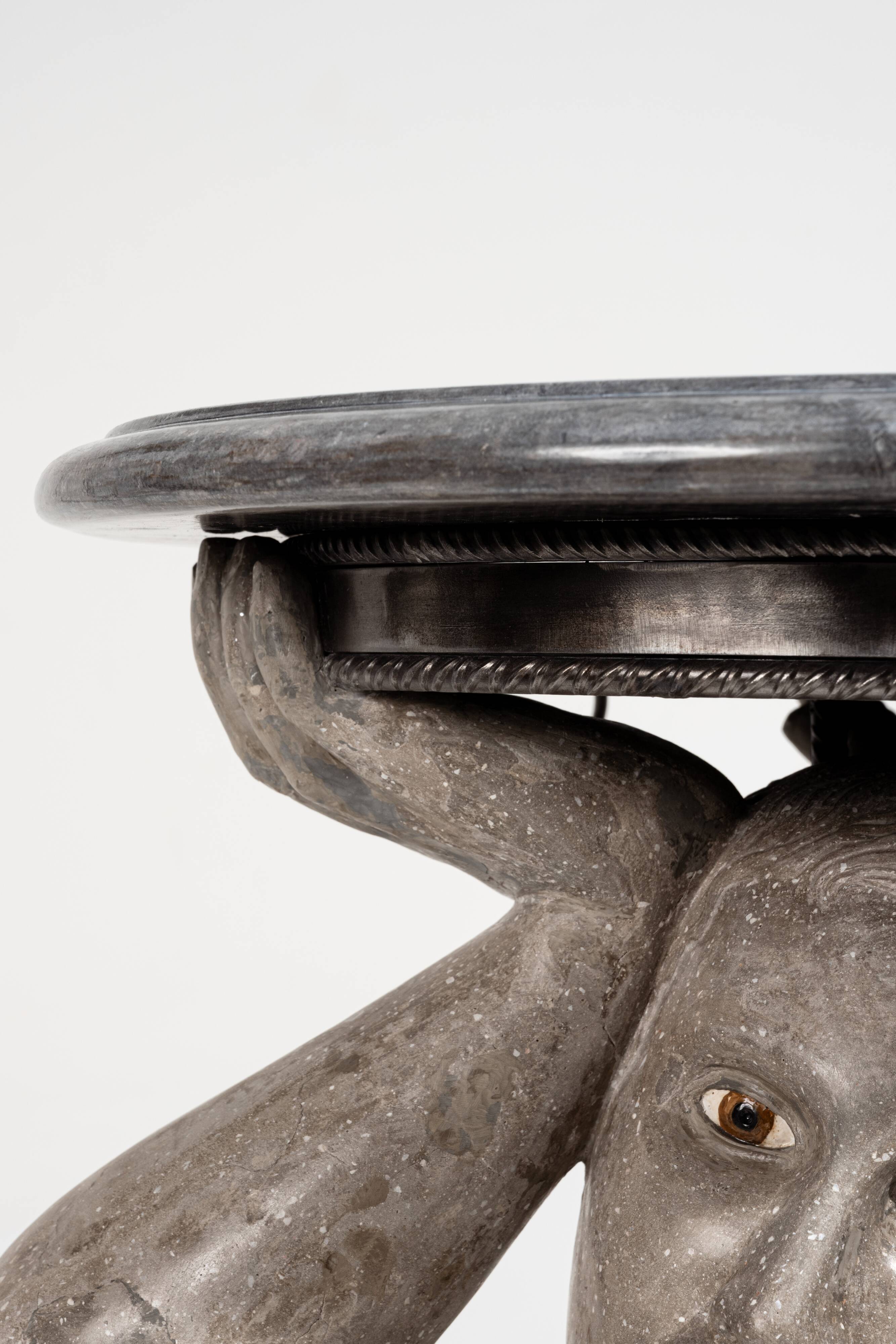 "Kneeling Strength" Pedestal Table