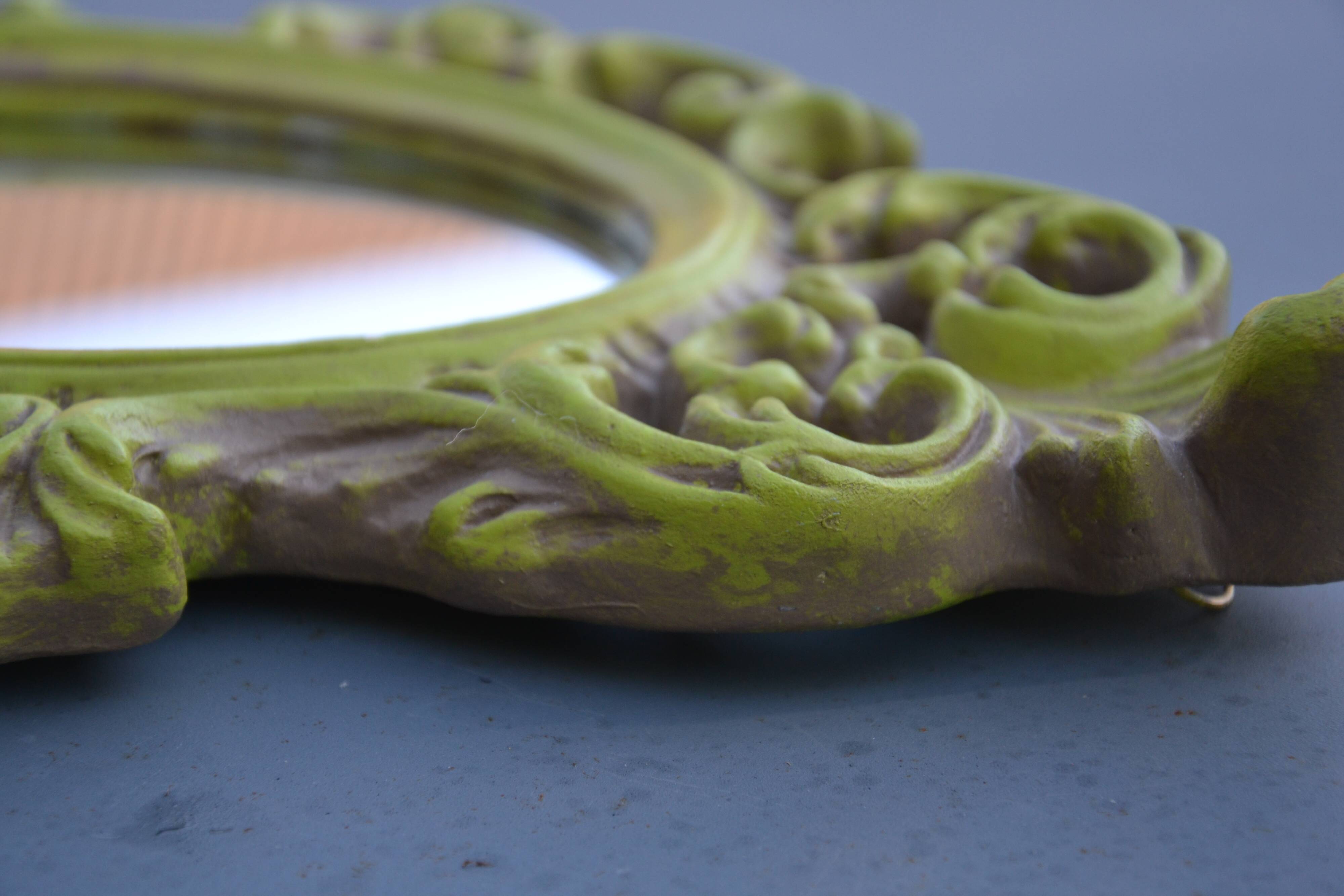 Small green wooden mirror