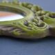Small green wooden mirror