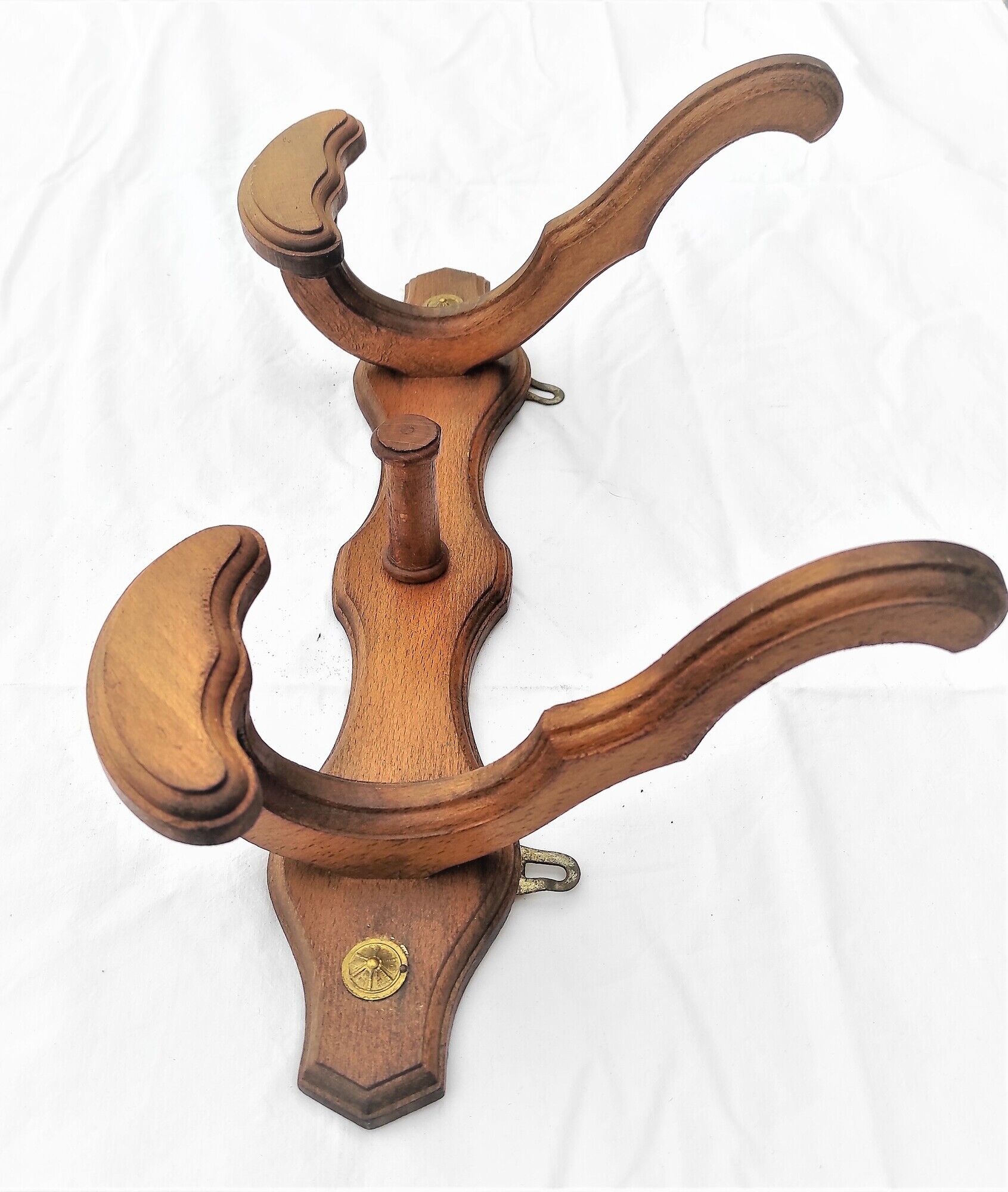 Wooden coats door with hat hanging in the center circa 1930