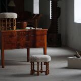 Pair of mid-century Danish oak stools with shearling lambswool upholstery, 1950s.
