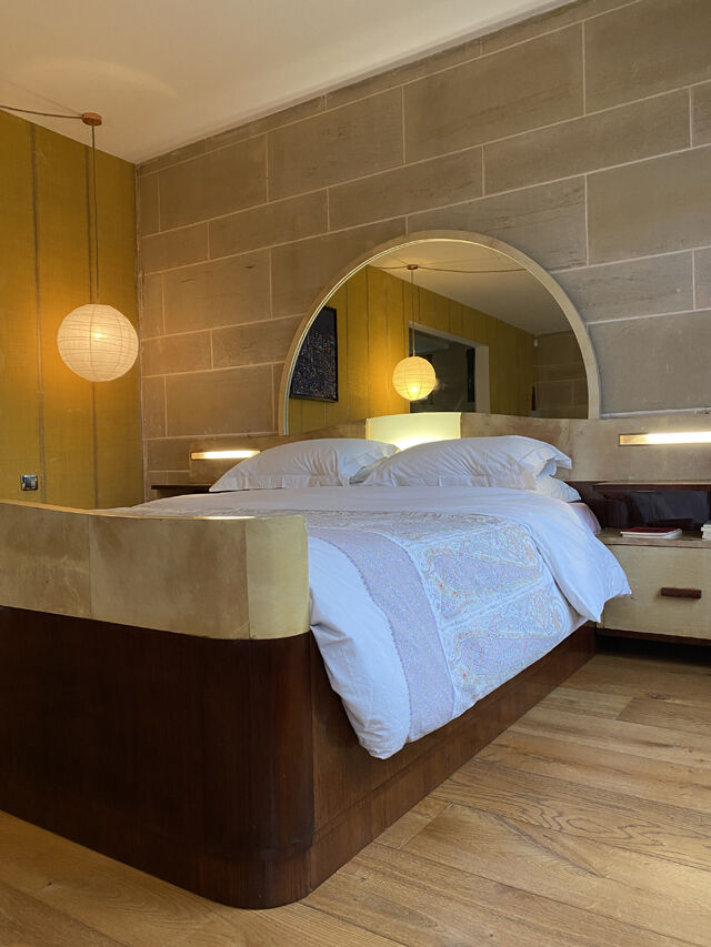 Bed with integrated bedside in rosewood and parchment, art deco period, twentieth century