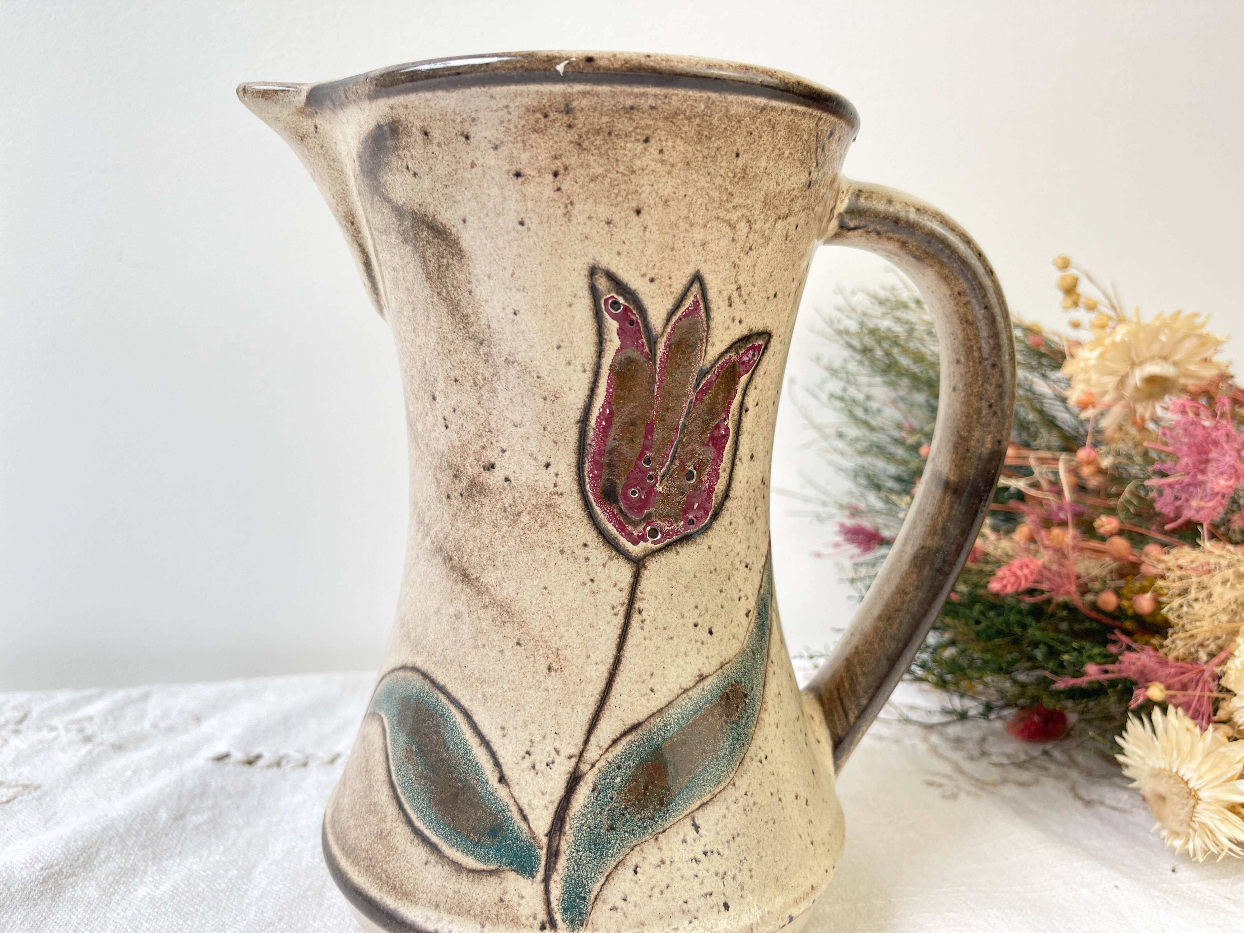 Ceramic pitcher from Les grottes dieulefit with floral pattern from the 1970s