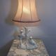 Ceramic lamp with birds, pink fringed shade, 1950s.