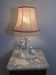 Ceramic lamp with birds, pink fringed shade, 1950s.