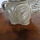 vintage ceramic teapot in the shape of a grey elephant